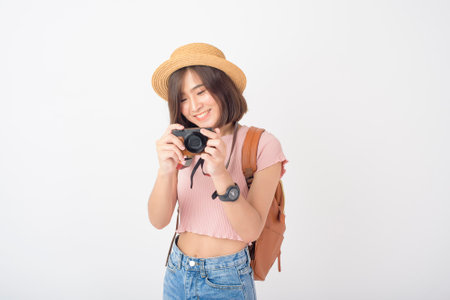 Beautiful young asian tourist woman happy on white background studioの写真素材