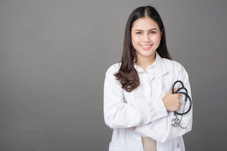 Smart woman doctor is holding stethoscopeの写真素材