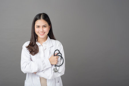 Smart woman doctor is holding stethoscopeの写真素材