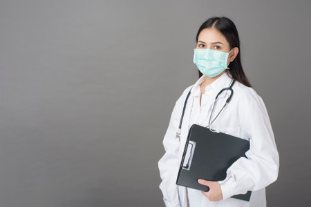 Smart woman doctor is holding stethoscopeの写真素材