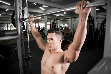Muscular fitness man bodybuilder is workout  in gym