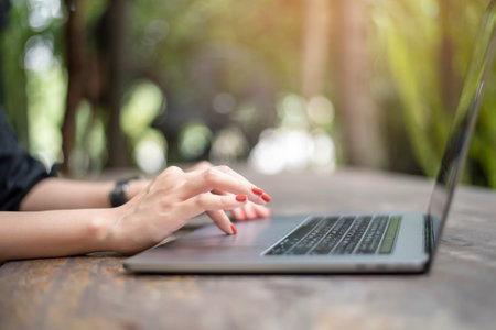 close up female hand on laptopの写真素材