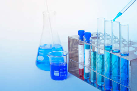 Laboratory background , microscope with lab glassware