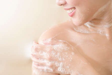 Happy  beautiful woman is taking a shower
