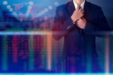 Close up of business man is  analytics finance graphic