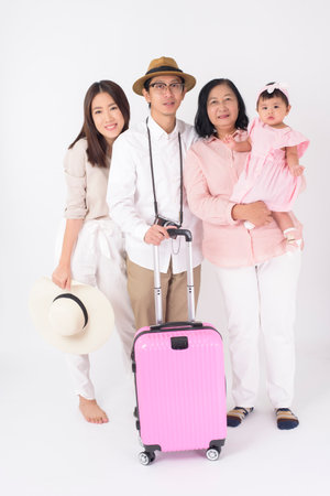 Happy Asian family are ready to travel on white background