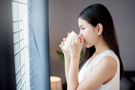 Beautiful woman is working from homeの写真素材