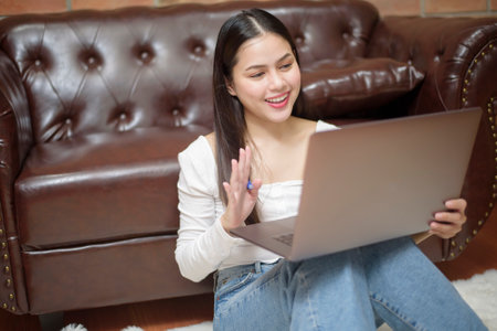 Beautiful woman is working from homeの写真素材