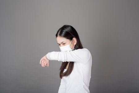 Portrait of woman with surgical mask  in studio, Health care conceptの写真素材
