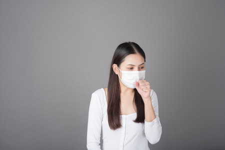Portrait of woman with surgical mask  in studio, Health care conceptの写真素材