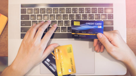 Woman hand is holding credit card, shopping onlineの写真素材