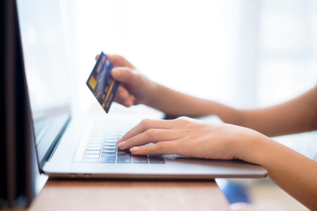 Woman hand is holding credit card, shopping onlineの写真素材