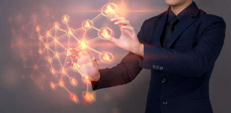 Businessman is touching digital virtual screen with connection people button , leadership people...