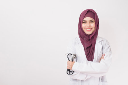 Beautiful woman doctor with hijab portrait on white backgroundの写真素材