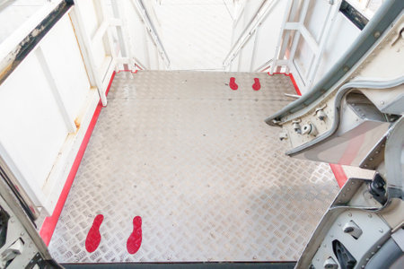 foot sign on airplane corridor, Social distancing protocol on aviation , New normal travel and transportation conceptの写真素材