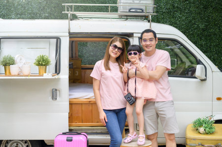 a joyful Asian family enjoying road trip and journey is going on holiday, travel and tourism conceptの写真素材