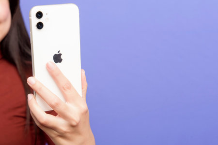 Bangkok, THAILAND, June 14, 2020: Woman hand holding Smart Phone Apple iPhone 11のeditorial素材