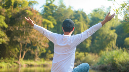 a young man is enjoying with nature , holiday and travel concept .の写真素材