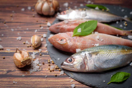 Fresh sea fish flat lay copy space on wood background