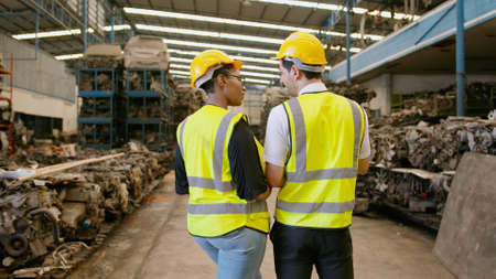 Engineering people are working in heavy industrial plant Engine parts factory .