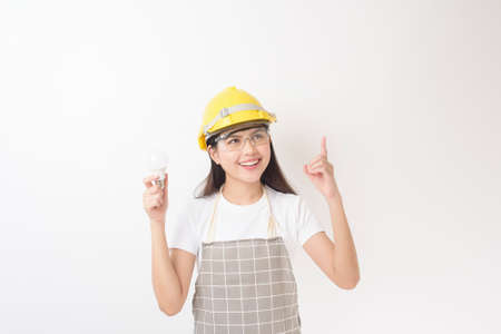 woman technician portrait on white backgroundの写真素材