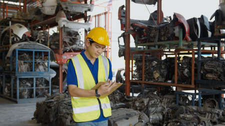 Engineering people are working in heavy industrial plant Engine parts factory .