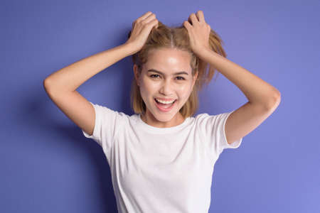 A portrait of short blonde hair woman in studioの写真素材