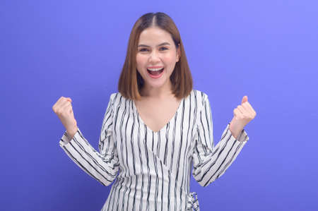 A portrait of young beautiful short hair woman in background studio.の写真素材