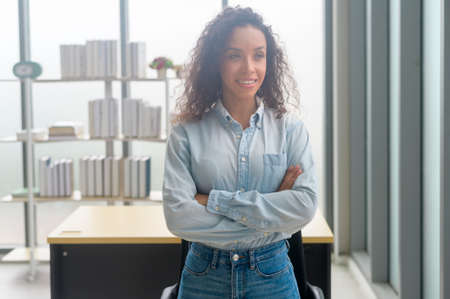 A portrait of young african businesswoman smiling in modern officeの写真素材