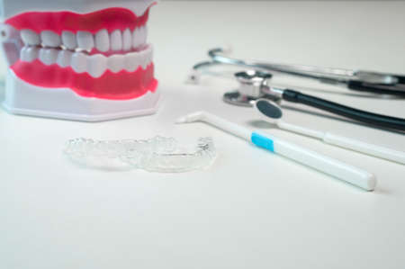 Invisalign braces and tools for dental care, dental healthcare and Orthodontic concept.の写真素材