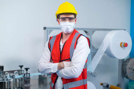 Quality control (QC) engineer monitoring and checking machine system in manufacturing factoryの写真素材