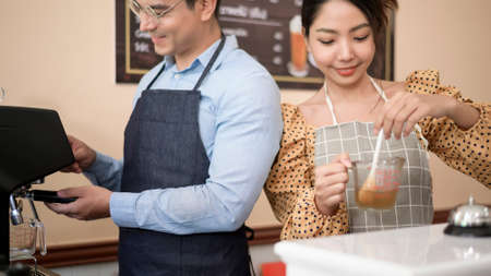 Baristas making and preparing a cup of coffee in coffee shopの写真素材