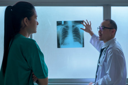 The doctor is analytic X-ray film , showing to patient , Health care conceptの写真素材