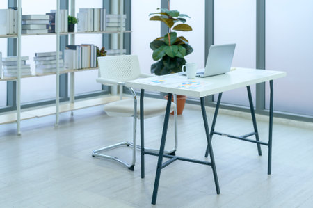 A computer on table in modern office