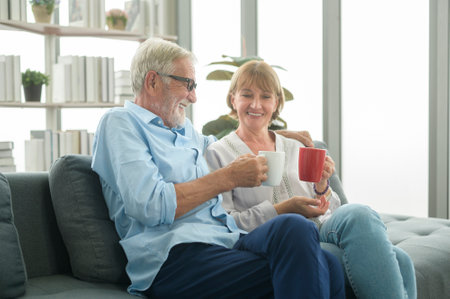 Happy Caucasian seniors couple are drinking coffee in home , relaxing and health care concept .の写真素材