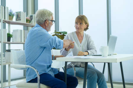 Caucasian senior Business people working and brainstorming in modern officeの写真素材