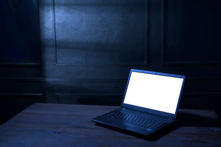 laptop computer with white screen  in the nightの写真素材