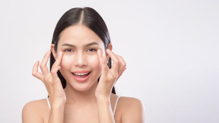 A portrait of young beautiful woman with smooth healthy skin on white background , Skincare conceptの写真素材