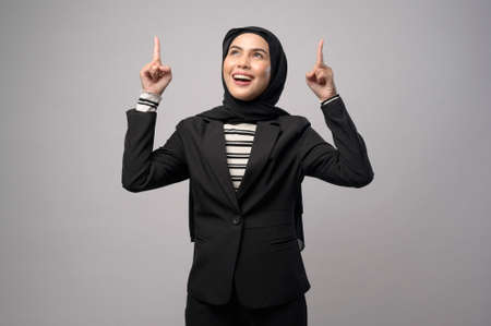 A beautiful business woman with hijab portrait on white backgroundの写真素材