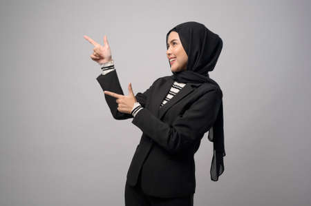 A beautiful business woman with hijab portrait on white backgroundの写真素材