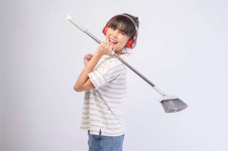 A young beautiful housewife smiling on white backgroundの写真素材
