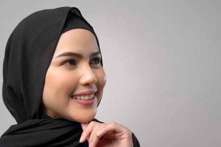 A beautiful business woman with hijab portrait on white backgroundの写真素材