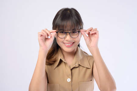 A beautiful woman wearing glasses over white background studioの写真素材