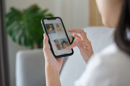 Close up woman hand shopping online food via smart phone. Online Business technology concept.の写真素材