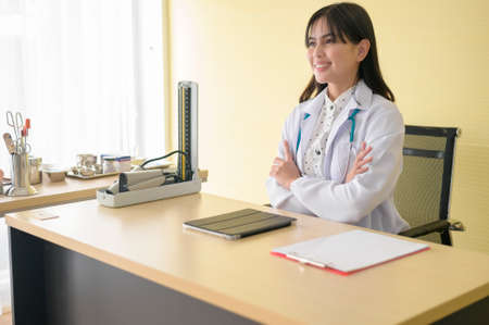 Portrait of young female doctor with stethoscope working at hospital, medical and health care conceptの写真素材