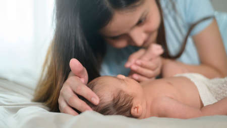 A Young mother with a Cute new born baby.の写真素材