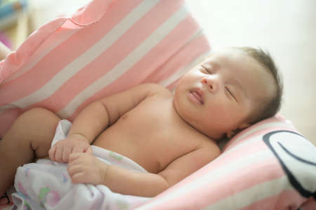 A Young mother with a Cute new born baby.の写真素材