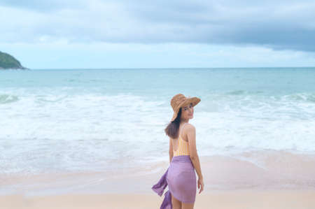 A Young Beautiful woman in Bikini enjoying and relaxing on the beach,  Summer, vacation, holidays, Lifestyles concept.の写真素材