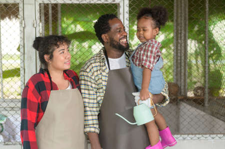 A Happy black agronomist family enjoying and working in farmland, agriculture concept