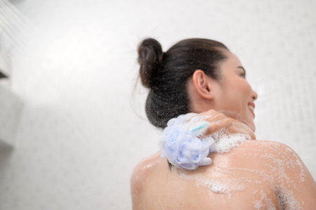 A Happy beautiful woman is taking a shower